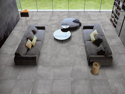 Salle de séjour avec carreaux en grès cérame gris